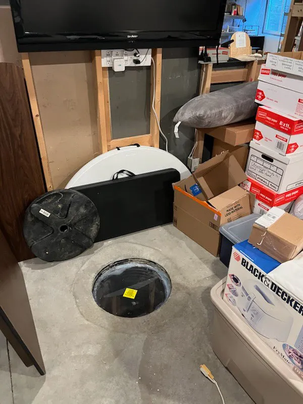 Plexiglass cover installed over the sump pit and sealed with silicone